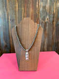 Navajo pearl necklace with sterling silver pink conch pendant