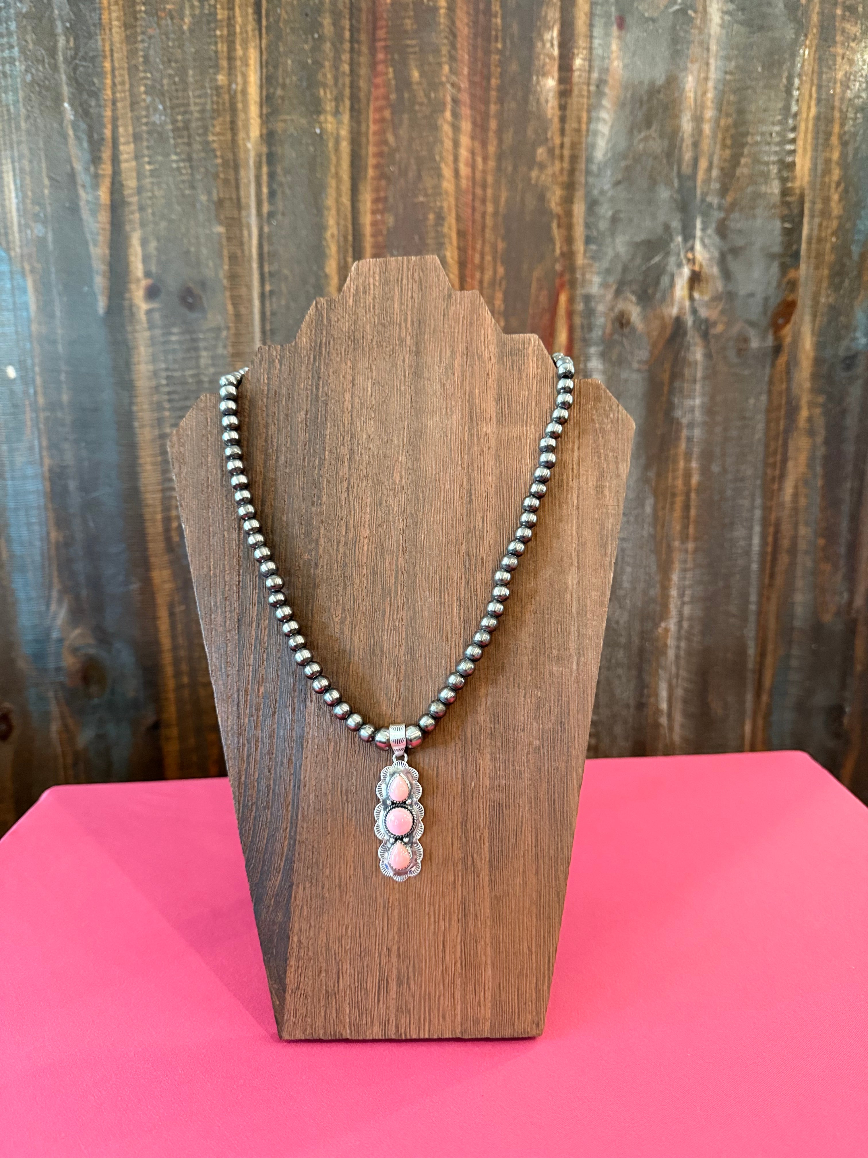 Navajo pearl necklace with sterling silver pink conch pendant